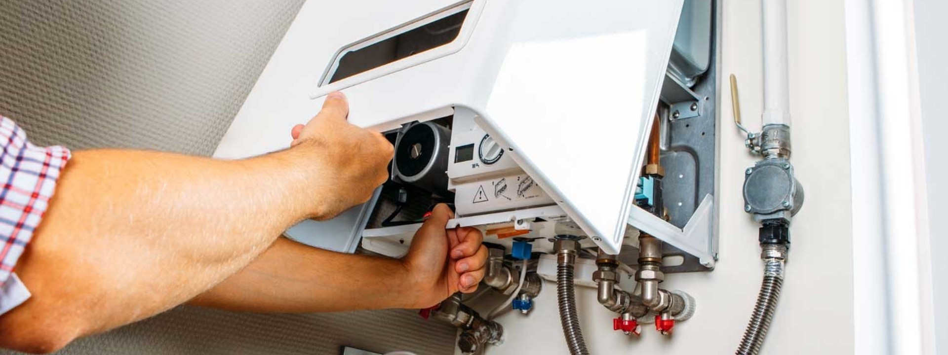 engineer repairing gas boiler